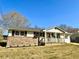 Well-maintained single-story home with a brick accent wall and charming front porch at 1091 Mountain View Nw Rd, Conyers, GA 30012