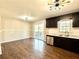 Modern kitchen with dark cabinetry, stainless steel appliances, and sliding glass doors to a deck at 1091 Mountain View Nw Rd, Conyers, GA 30012