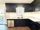 Updated kitchen with stainless steel appliances, subway tile backsplash, and door to the deck at 1091 Mountain View Nw Rd, Conyers, GA 30012