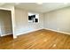 Open living room space with hardwood floors and an opening to the kitchen at 1091 Mountain View Nw Rd, Conyers, GA 30012