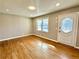 Bright living room with hardwood floors and a stylish front door at 1091 Mountain View Nw Rd, Conyers, GA 30012