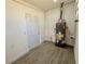 Utility room featuring a hot water heater and a gray vinyl floor at 1091 Mountain View Nw Rd, Conyers, GA 30012