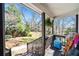 Relaxing covered back porch with a view of the lush backyard landscaping at 194 Church Se Rd, Smyrna, GA 30082