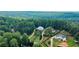 Expansive aerial view of multiple homes surrounded by lush greenery and mature trees at 210 Wrights Mill Way, Canton, GA 30115