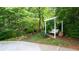 Secluded backyard featuring a cozy pergola with comfortable seating and lush greenery at 210 Wrights Mill Way, Canton, GA 30115