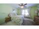 Cozy bedroom featuring a ceiling fan, a bright window bench seat and a lovely queen size bed at 210 Wrights Mill Way, Canton, GA 30115