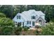 Charming two-story home featuring a stone facade and a well-manicured front garden at 210 Wrights Mill Way, Canton, GA 30115