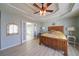 Tranquil main bedroom featuring tray ceilings, chandelier, and ensuite bathroom at 210 Wrights Mill Way, Canton, GA 30115