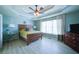 Comfortable main bedroom with tray ceilings, ample natural light, and wood-look floors at 210 Wrights Mill Way, Canton, GA 30115