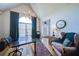 Bright office space with a vaulted ceiling, large window, and elegant decor at 210 Wrights Mill Way, Canton, GA 30115