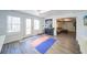 Workout area with ample natural light, a mini bar, and a view into the finished basement at 210 Wrights Mill Way, Canton, GA 30115