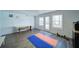 Bright workout area featuring a table, workout mats, and a door to the backyard at 210 Wrights Mill Way, Canton, GA 30115