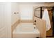 Bathroom featuring a soaking tub next to a glass enclosed shower at 4594 Marching Ln, Fairburn, GA 30213