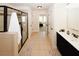 Hallway bathroom with a shower featuring glass doors, and a single-sink vanity at 4594 Marching Ln, Fairburn, GA 30213