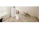 Future kitchen area with tile flooring and prepped walls ready for appliances to be installed for customization at 4594 Marching Ln, Fairburn, GA 30213