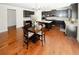 Well-lit open kitchen with a large island, stainless steel appliances and dining area at 4594 Marching Ln, Fairburn, GA 30213