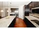 Open kitchen with a large island, stainless steel appliances and gas range at 4594 Marching Ln, Fairburn, GA 30213
