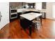 Modern kitchen with granite counters, stainless steel appliances, and large center island at 4594 Marching Ln, Fairburn, GA 30213