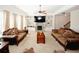 Cozy living room with built-in shelving, fireplace and plush seating at 4594 Marching Ln, Fairburn, GA 30213