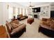 Warm living room featuring a fireplace, built-in shelving and neutral decor at 4594 Marching Ln, Fairburn, GA 30213