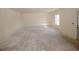 An empty living room is ready for customizations and personalization at 4594 Marching Ln, Fairburn, GA 30213