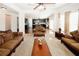 Inviting living room with view of kitchen, complete with plush seating and natural light at 4594 Marching Ln, Fairburn, GA 30213