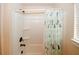 A bathtub-shower combo is adorned with a curtain with a fun cactus pattern at 4594 Marching Ln, Fairburn, GA 30213