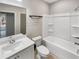 Clean and modern bathroom with a tub, shower, toilet, and vanity sink at 507 N Gwinnett St, Buford, GA 30518