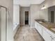Bright bathroom with granite countertop, tile flooring, bathtub, and modern fixtures at 507 N Gwinnett St, Buford, GA 30518
