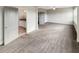 Bedroom with plush carpet flooring, neutral walls, ceiling fan, and an ensuite bathroom at 507 N Gwinnett St, Buford, GA 30518
