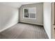 Bright bedroom with a window, plush carpeting, and a calming color palette at 507 N Gwinnett St, Buford, GA 30518