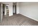 Bedroom with neutral carpet and paint, with door leading to the ensuite bathroom at 507 N Gwinnett St, Buford, GA 30518
