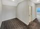 View of an airy room featuring plush carpet, light-colored walls, and an open doorway at 507 N Gwinnett St, Buford, GA 30518