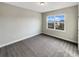 Bedroom with carpet and view of neighborhood at 507 N Gwinnett St, Buford, GA 30518