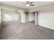 Large bedroom featuring plush carpet, neutral walls, and multiple doorways at 507 N Gwinnett St, Buford, GA 30518