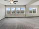 Bedroom featuring neutral walls, plush carpet, and natural lighting at 507 N Gwinnett St, Buford, GA 30518