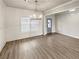 Dining room featuring wainscotting, chandelier, and hardwood floors at 507 N Gwinnett St, Buford, GA 30518
