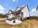 Charming single-Gathering home with a brick and white facade, and a two-car garage at 507 N Gwinnett St, Buford, GA 30518