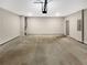 Large two-car garage featuring an automatic door opener and ample space for parking and storage at 507 N Gwinnett St, Buford, GA 30518