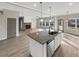 Spacious kitchen with a large island, granite counters, and stainless steel appliances at 507 N Gwinnett St, Buford, GA 30518