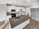 Well-equipped kitchen with stainless steel appliances, granite countertops, and a center island at 507 N Gwinnett St, Buford, GA 30518