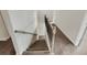 Carpeted staircase with neutral walls and contemporary railing at 507 N Gwinnett St, Buford, GA 30518