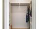 A closet with organizers on the side and a metal rod for hanging clothes at 6463 Century Park Se Pl, Mableton, GA 30126