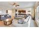 Comfortable living room featuring a cozy sofa and an open-concept design leading to the kitchen at 6463 Century Park Se Pl, Mableton, GA 30126