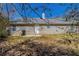 View of the back exterior featuring horizontal siding, a door to the yard, and a small patio at 11139 Silver Aspen Ct, Hampton, GA 30228