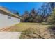 Spacious backyard with ample greenery and a concrete patio, perfect for outdoor activities and relaxation at 11139 Silver Aspen Ct, Hampton, GA 30228