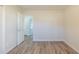 An empty bedroom with an open door leading to other rooms at 11139 Silver Aspen Ct, Hampton, GA 30228