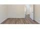An open bedroom with an open door to the rest of the home at 11139 Silver Aspen Ct, Hampton, GA 30228