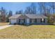 Charming single-story home featuring a well-manicured lawn and an attached single car garage at 11139 Silver Aspen Ct, Hampton, GA 30228