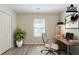 A staged home office with a desk, chair and hardwood floors at 11139 Silver Aspen Ct, Hampton, GA 30228